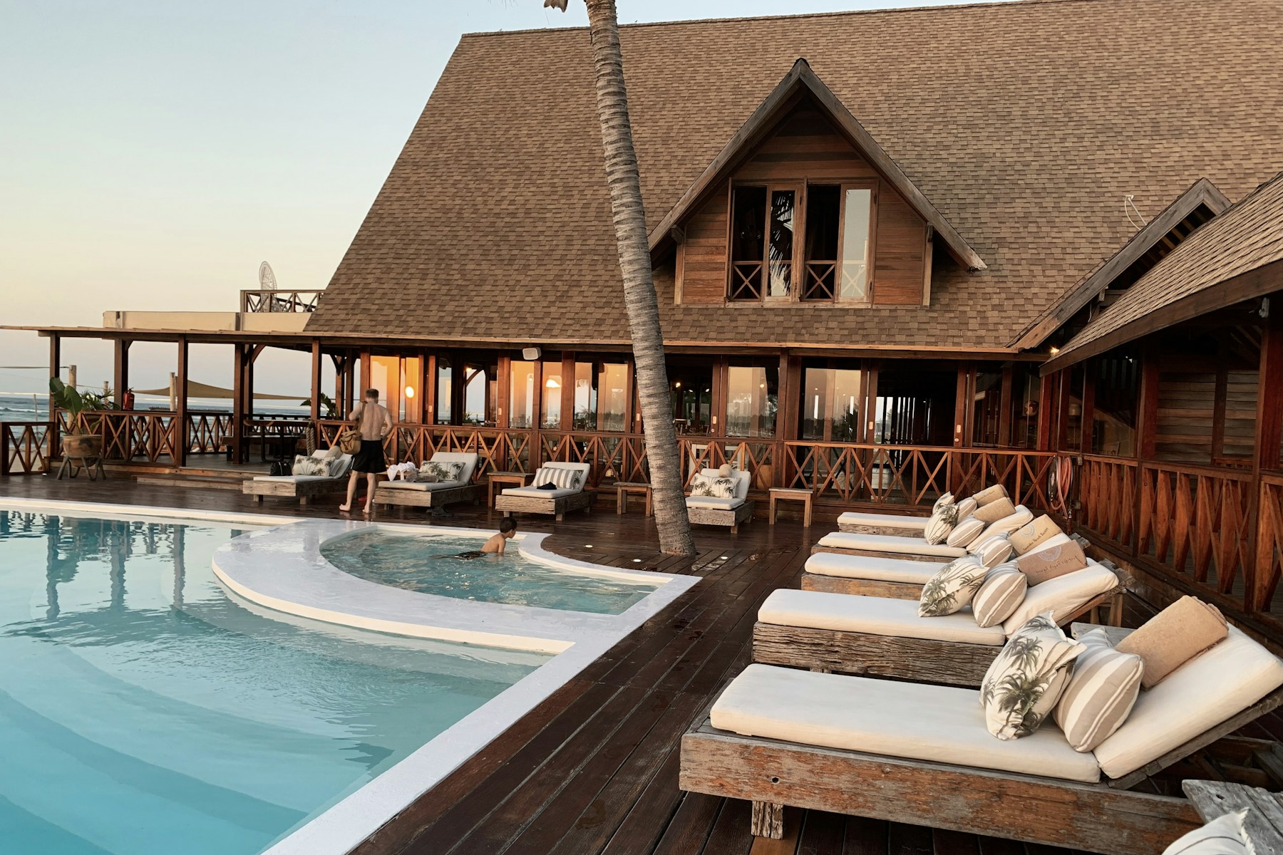 Hotel pool overlooking a tropical landscape
